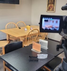 Lapel microphone plugged into camera, ideal for interviews etc.